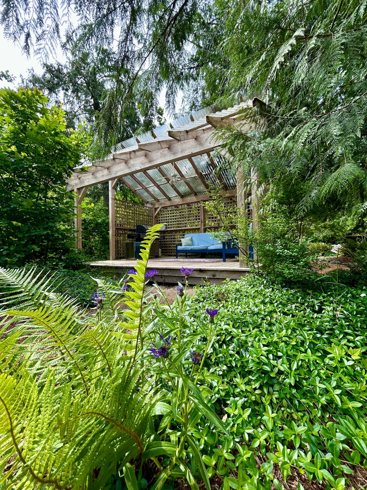 The timber gazebo nestled in lush gardens at Watermark